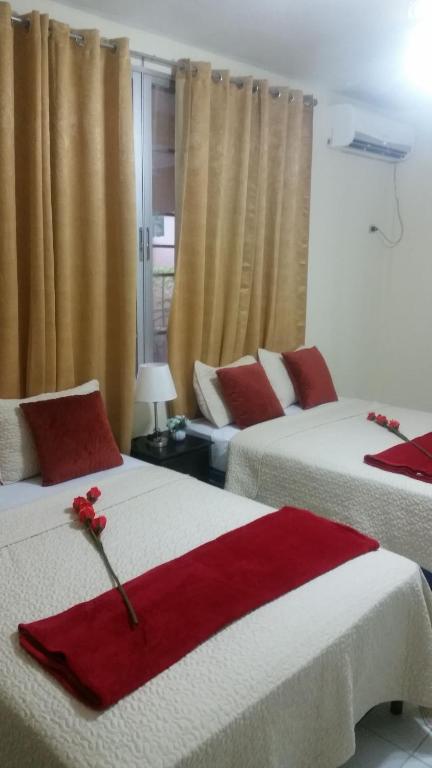 Postel nebo postele na pokoji v ubytování MH Boutique Hotel