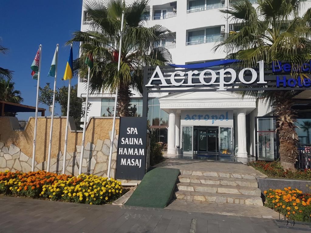 a building with a sign in front of it at Acropol Beach Hotel in Antalya