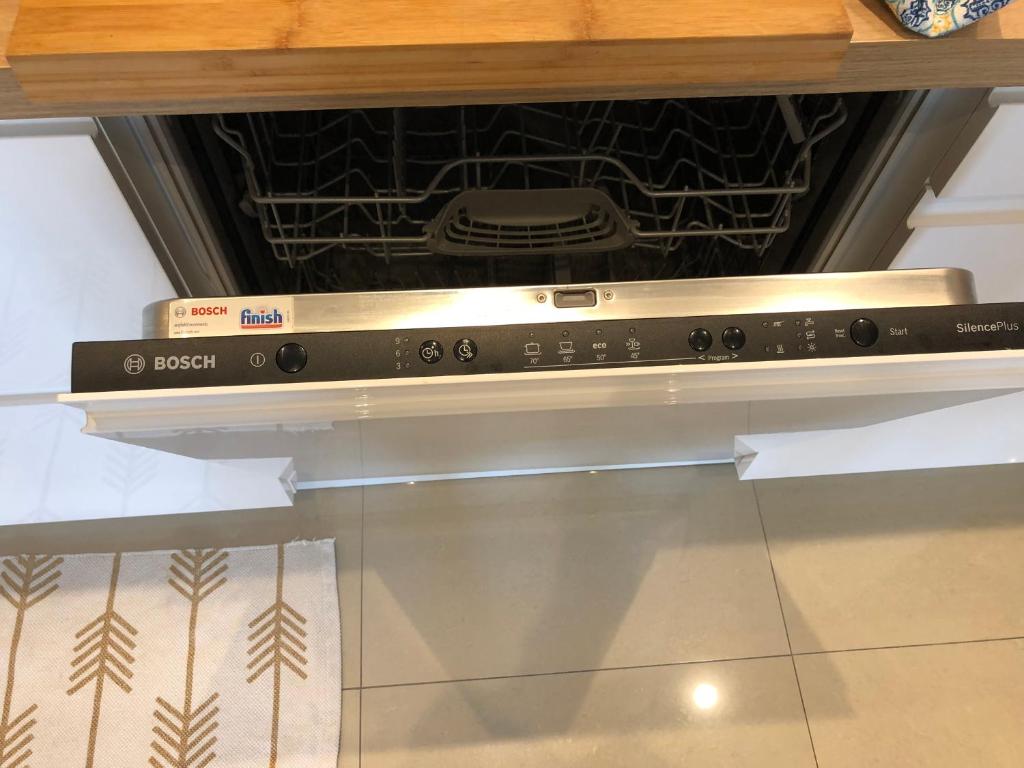 an oven with two boxes on top of it at Appartement Cosy Calme Central-Terrasse Proche Palais in Cannes
