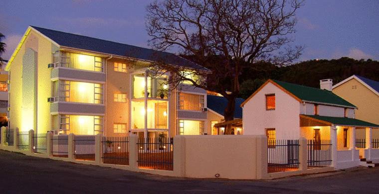 a large house with lights on in front of it at The Russel Hotel in Knysna