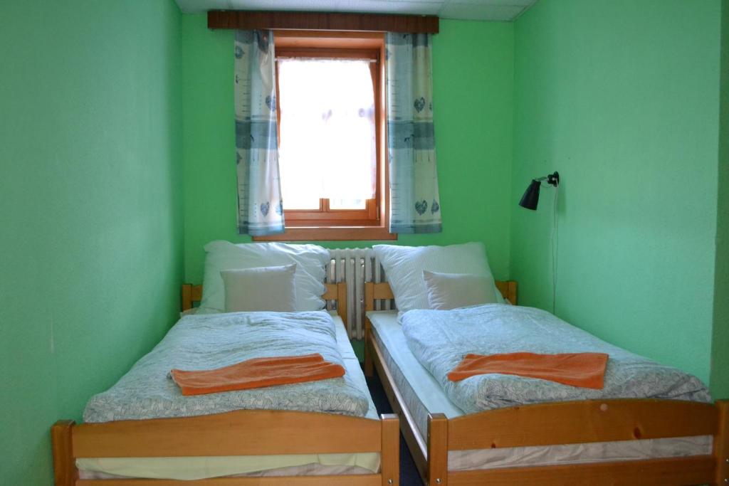 Postel nebo postele na pokoji v ubytování Penzion U mlýna