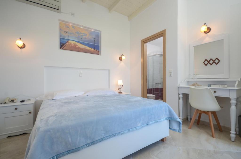 Postel nebo postele na pokoji v ubytování Hotel Anixis
