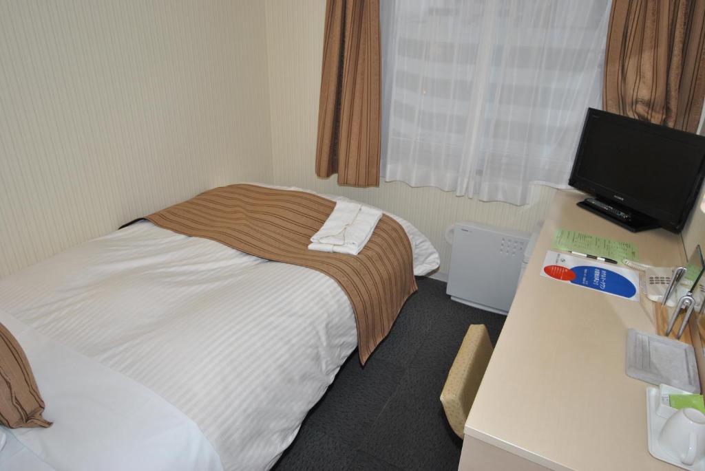 Postel nebo postele na pokoji v ubytování Hotel Mark-1 Abiko
