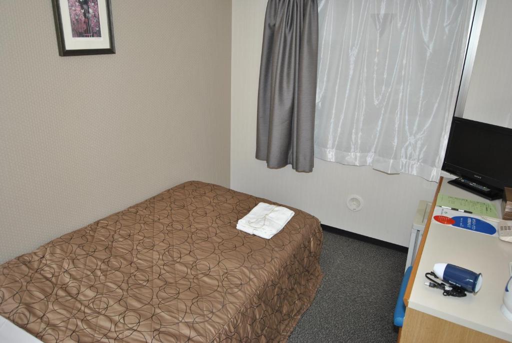 Postel nebo postele na pokoji v ubytování Hotel Mark-1 Abiko