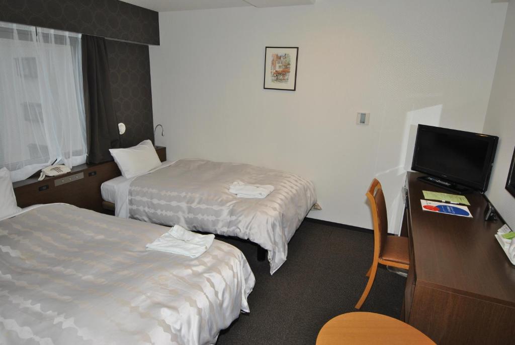 Postel nebo postele na pokoji v ubytování Hotel Mark-1 Abiko