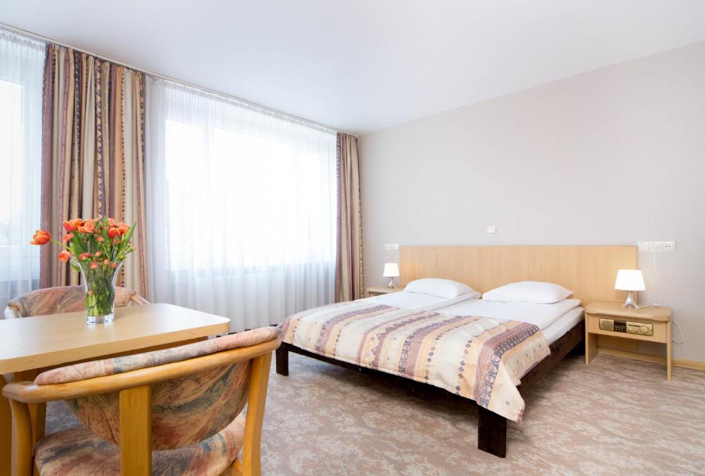 Posteľ alebo postele v izbe v ubytovaní Hotel Mazowiecki Łódź