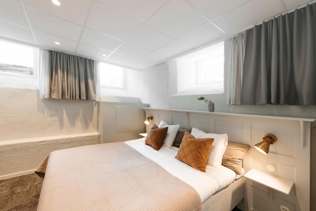 Postel nebo postele na pokoji v ubytování SPiS Hotell Amber