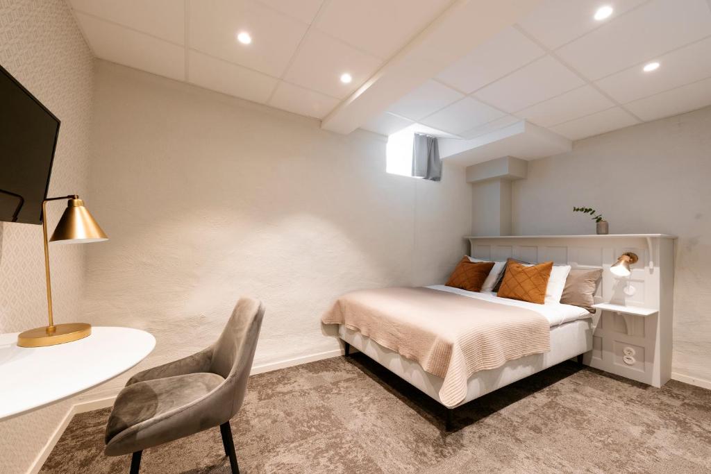 Postel nebo postele na pokoji v ubytování SPiS Hotell Amber