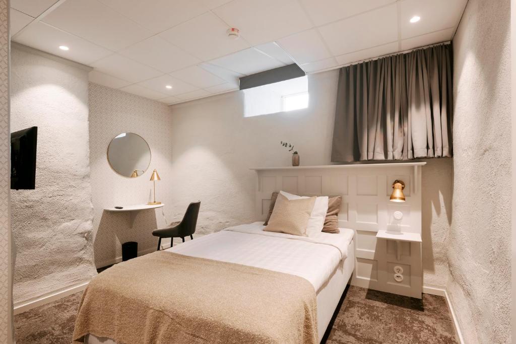 Postel nebo postele na pokoji v ubytování SPiS Hotell Amber