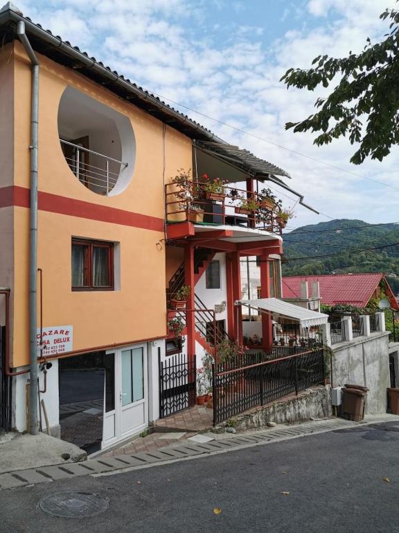 a building with a window on the side of it at Casa DeLux in Băile Olăneşti