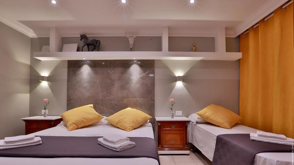 Postel nebo postele na pokoji v ubytování Hotel Giolitti Smart