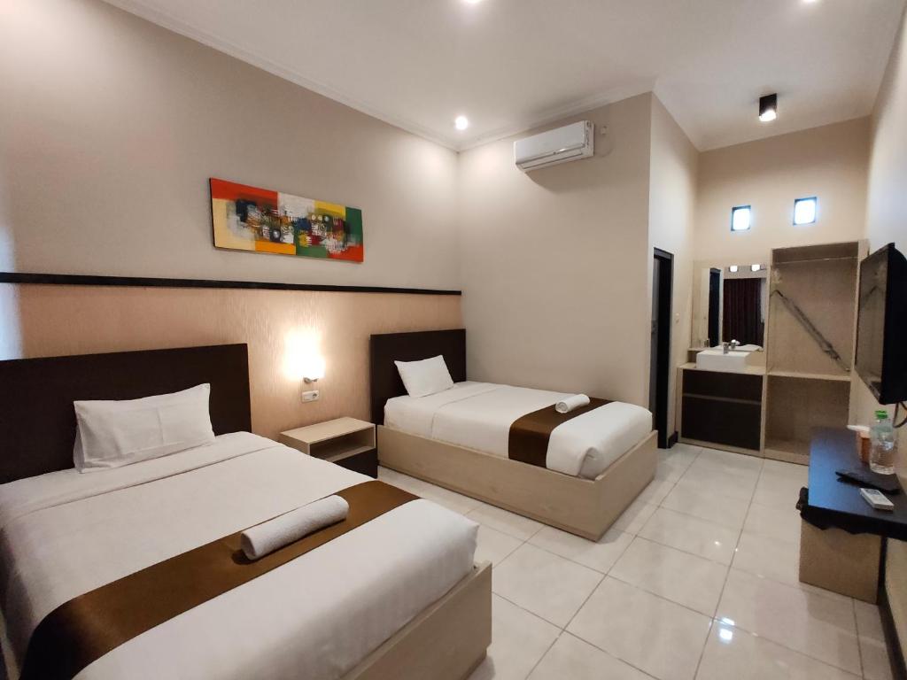 Postel nebo postele na pokoji v ubytování Hotel Orizatha