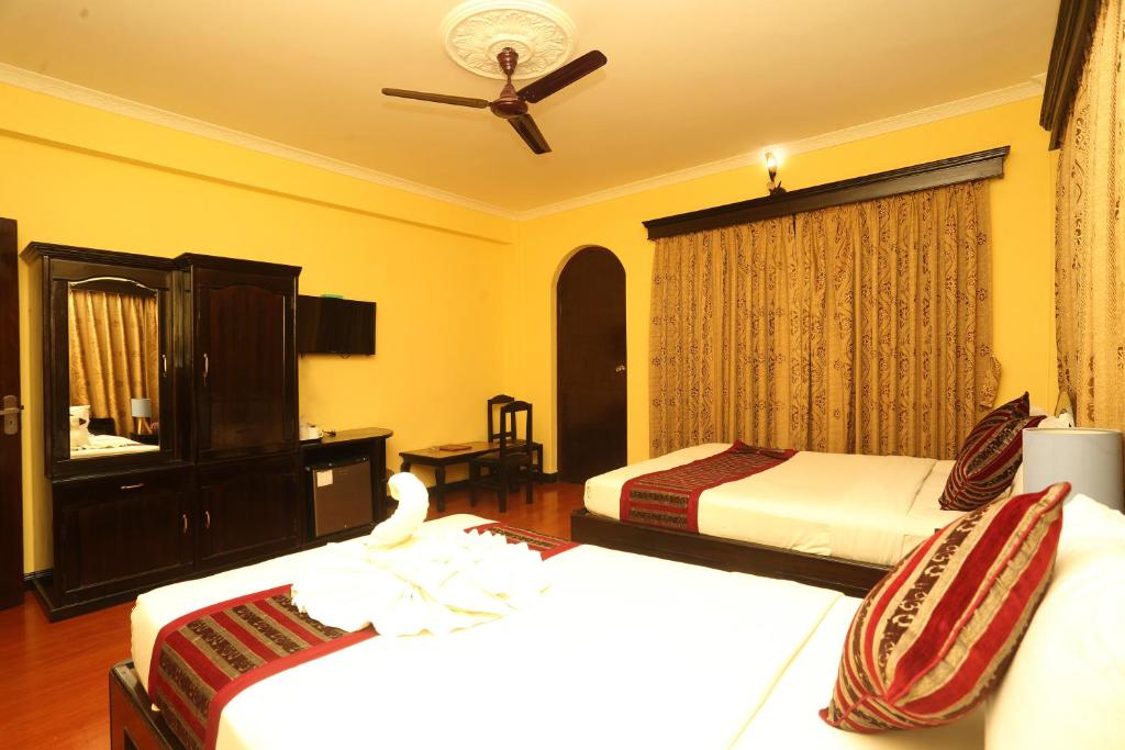 Katil atau katil-katil dalam bilik di Hotel Bougainvillea