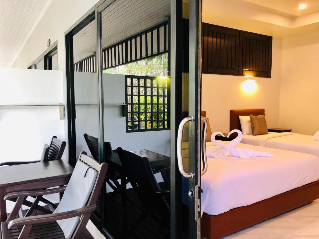 Postel nebo postele na pokoji v ubytování Lamai Inn 99 Bungalows