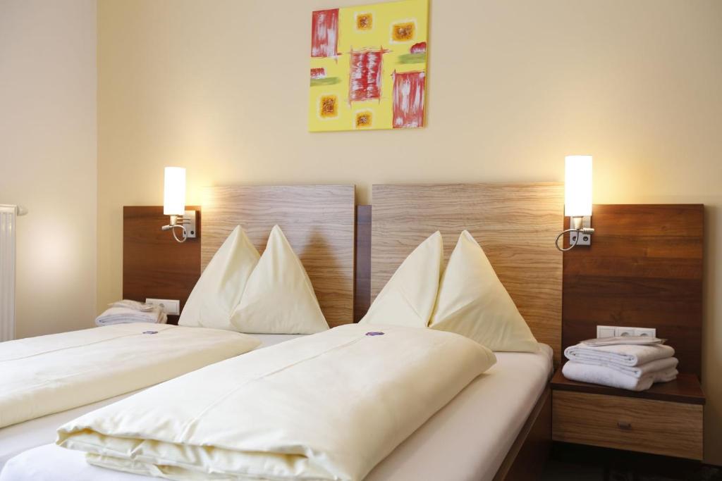 Postel nebo postele na pokoji v ubytování Premium Wanderhotel Steirerhof