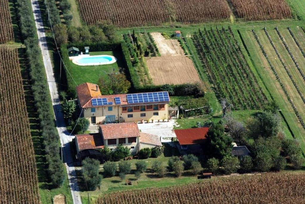 an aerial view of a house with solar panels on it at Il Chicco d'Oro in Massarosa