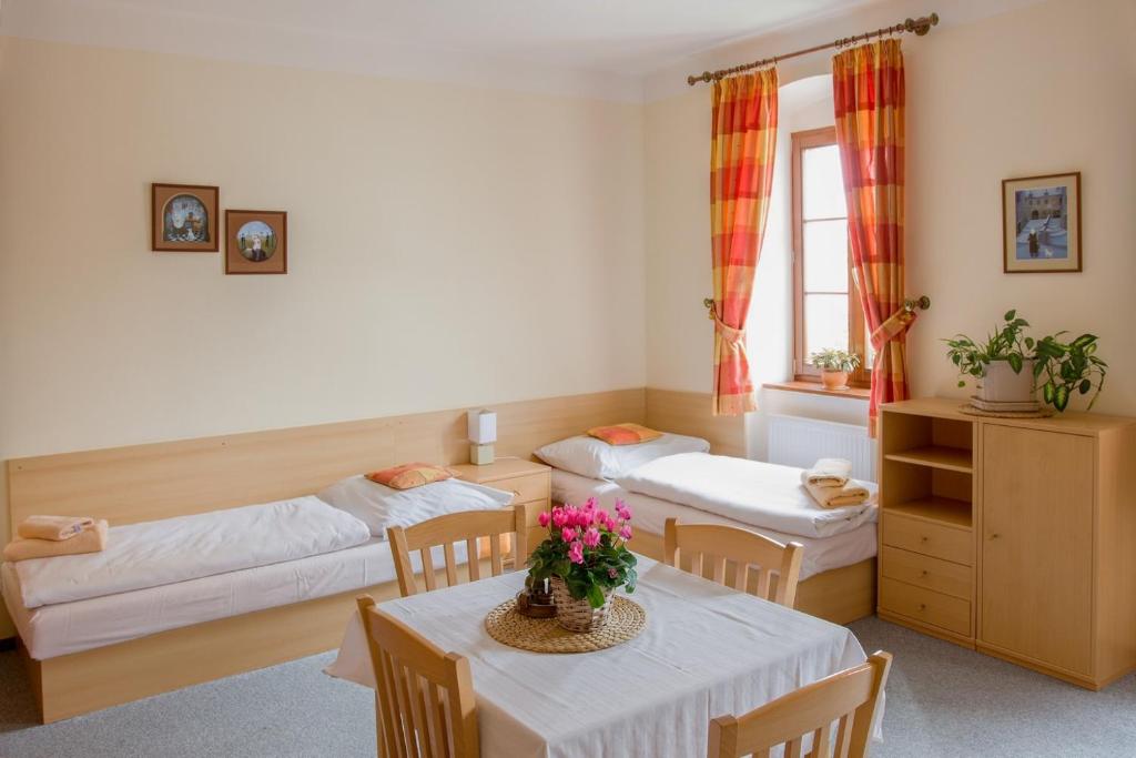 Postel nebo postele na pokoji v ubytování Apartmany A.Ša Kašperské Hory