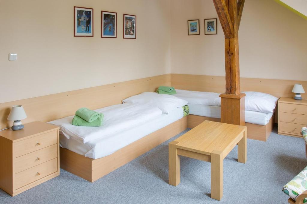Postel nebo postele na pokoji v ubytování Apartmany A.Ša Kašperské Hory