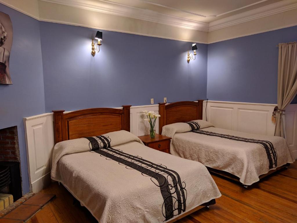 Postel nebo postele na pokoji v ubytování Hotel Real Del Monte