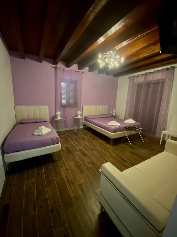 Posteľ alebo postele v izbe v ubytovaní Antico Borgo San Francesco