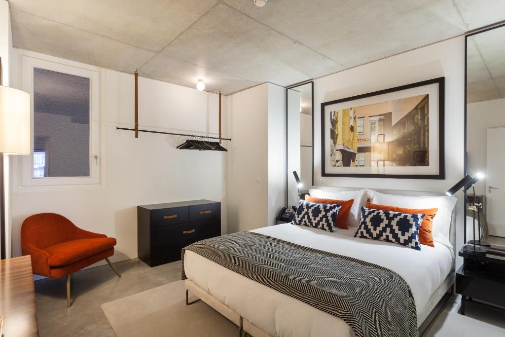 Postel nebo postele na pokoji v ubytování S.Bento Residences