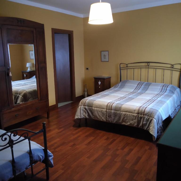 Posteľ alebo postele v izbe v ubytovaní B&B Cascina Baraggione
