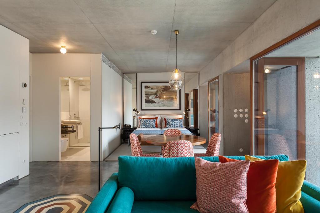 a living room with a couch and a table at S.Bento Residences in Porto