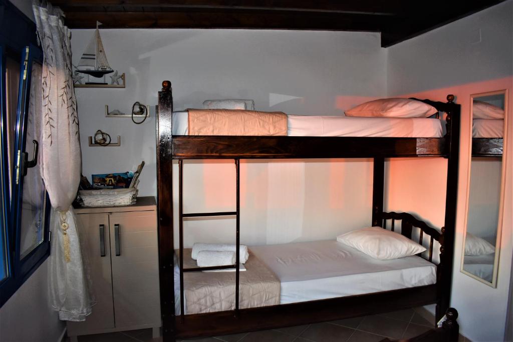 Postel nebo postele na pokoji v ubytování Villa Marzi Kalymnos