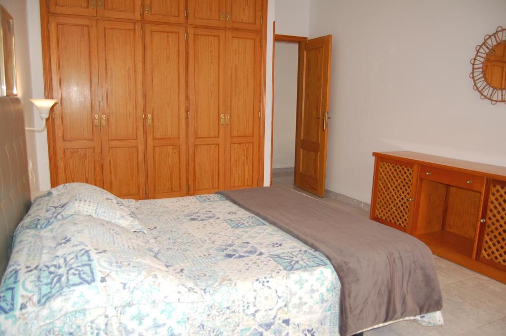 Posteľ alebo postele v izbe v ubytovaní APARTAMENTOS LOS LAURELES