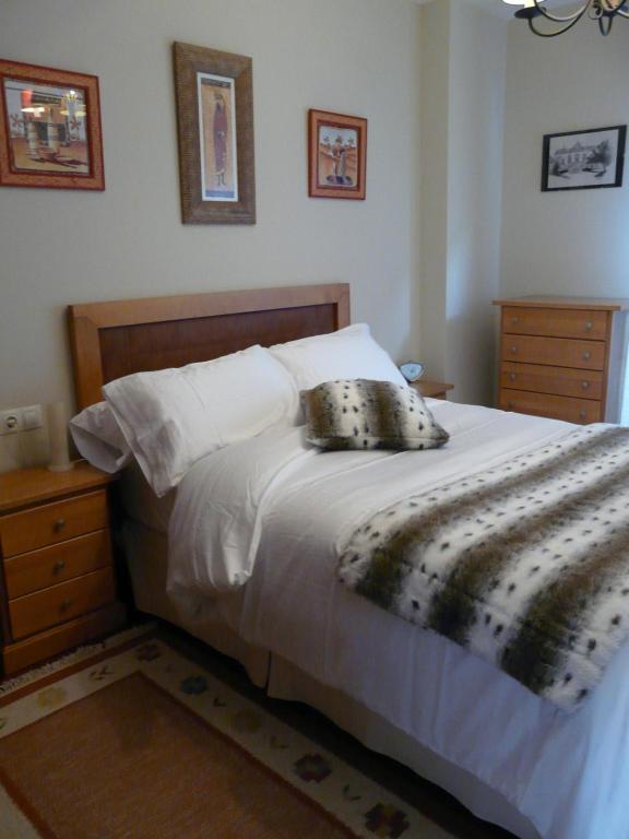 A bed or beds in a room at Espe Daga Apartamento