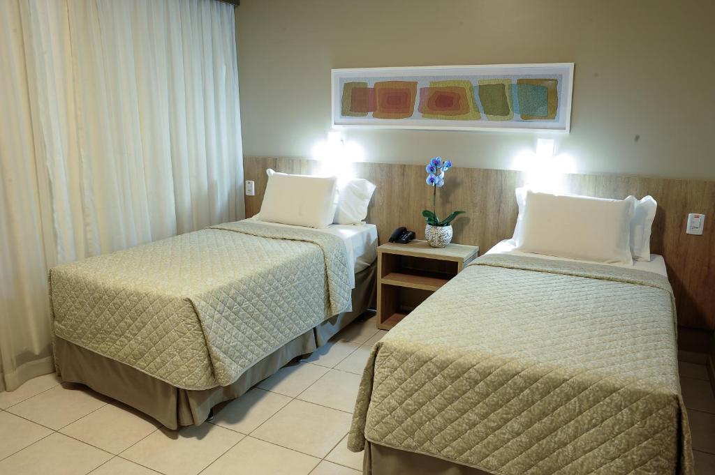 Postel nebo postele na pokoji v ubytování Plaza Inn Augustus
