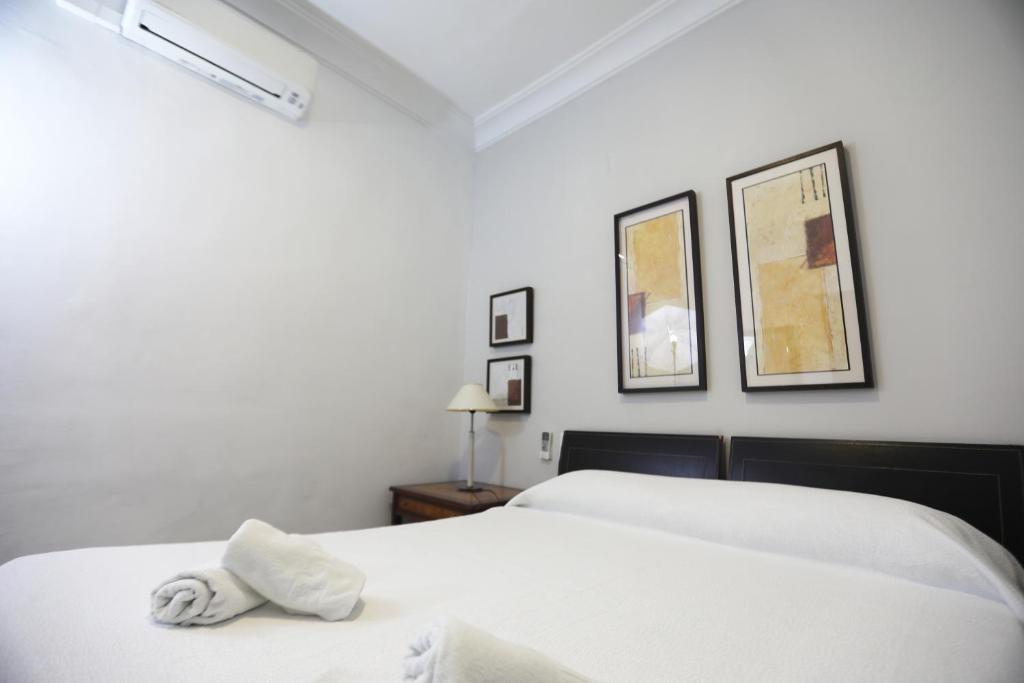 Łóżko lub łóżka w pokoju w obiekcie Apartamento Mar de Korus