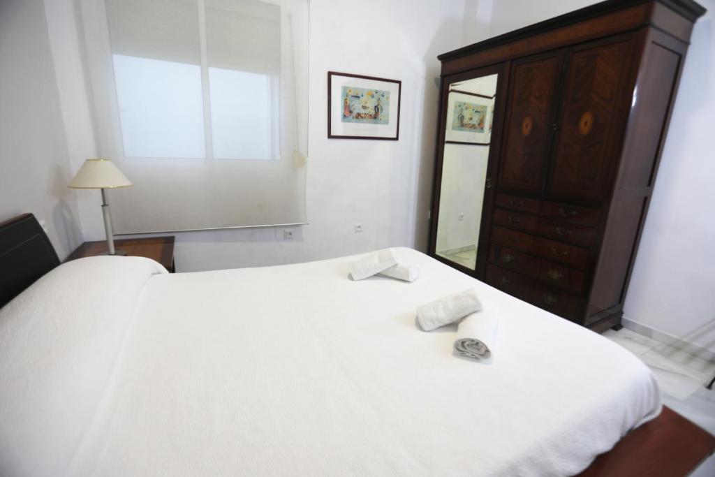 Łóżko lub łóżka w pokoju w obiekcie Apartamento Mar de Korus