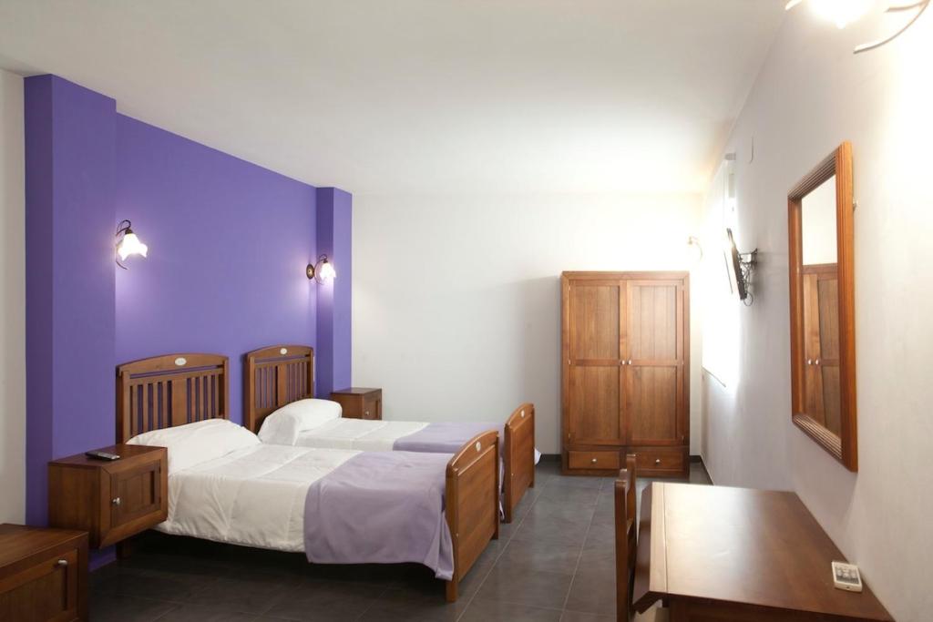 Katil atau katil-katil dalam bilik di Casa Rural Casole