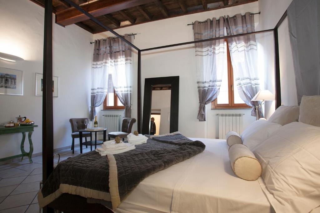 Кровать или кровати в номере Magenta Luxury Purificazione