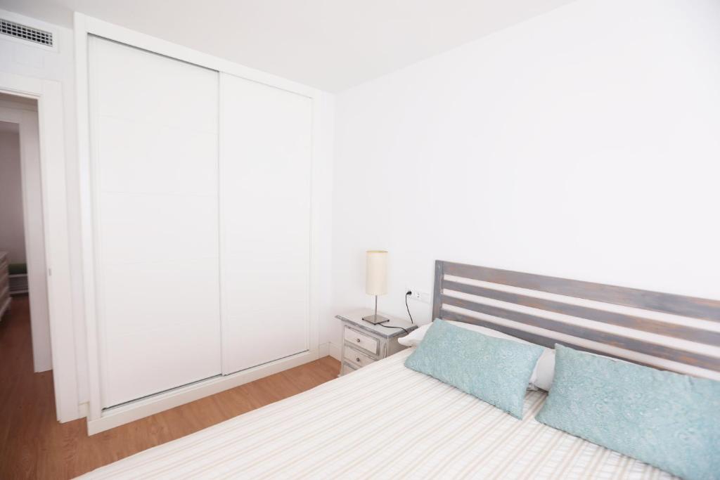 Posteľ alebo postele v izbe v ubytovaní Apartamento Rialto