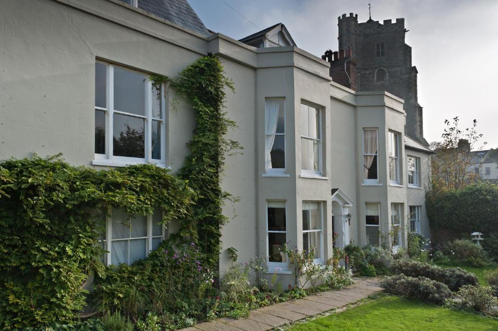 a house with ivy growing on the side of it at The Old Rectory in Hastings