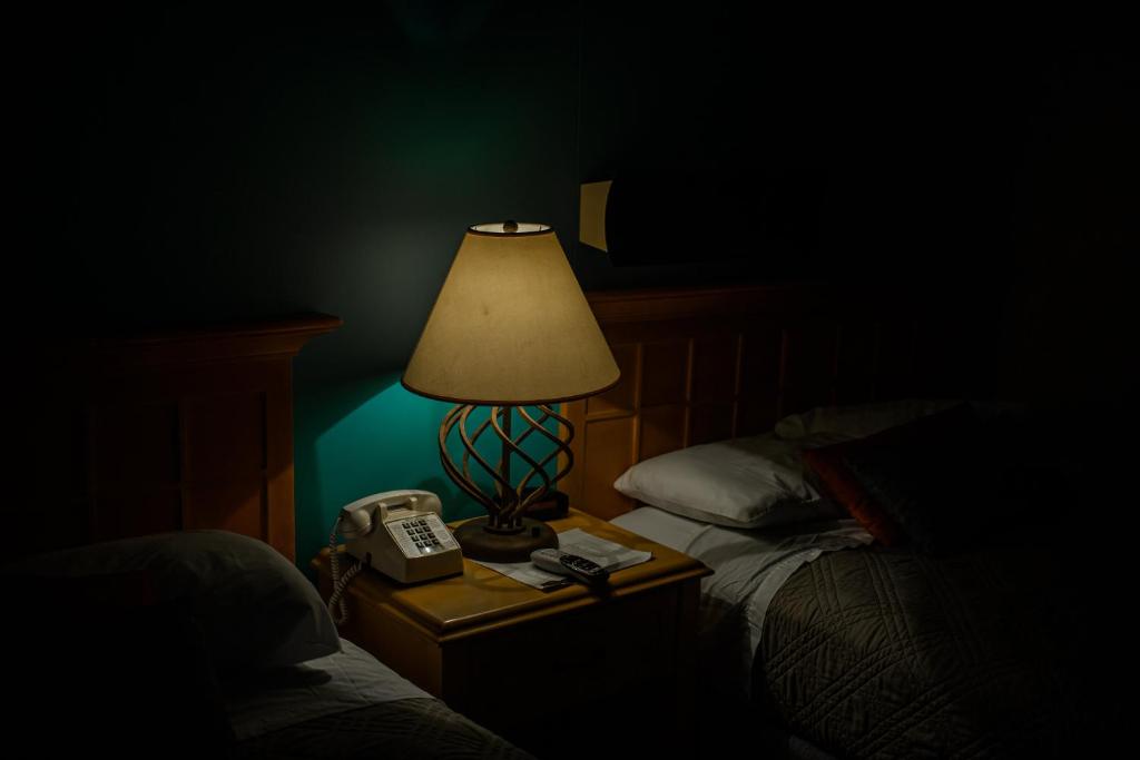Postel nebo postele na pokoji v ubytování Kokopelli Inn