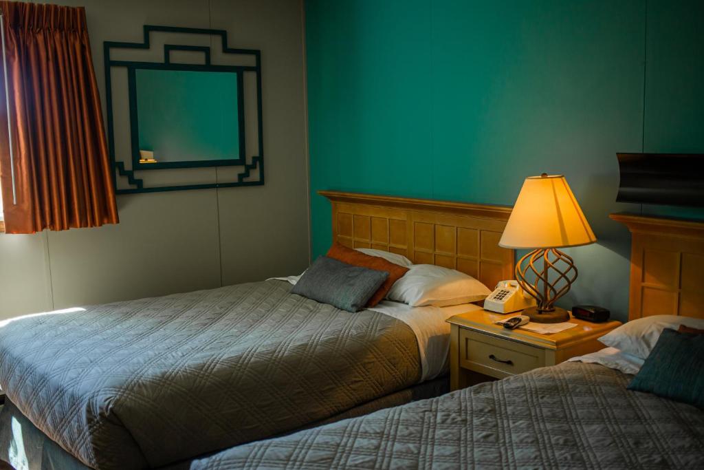 Postel nebo postele na pokoji v ubytování Kokopelli Inn