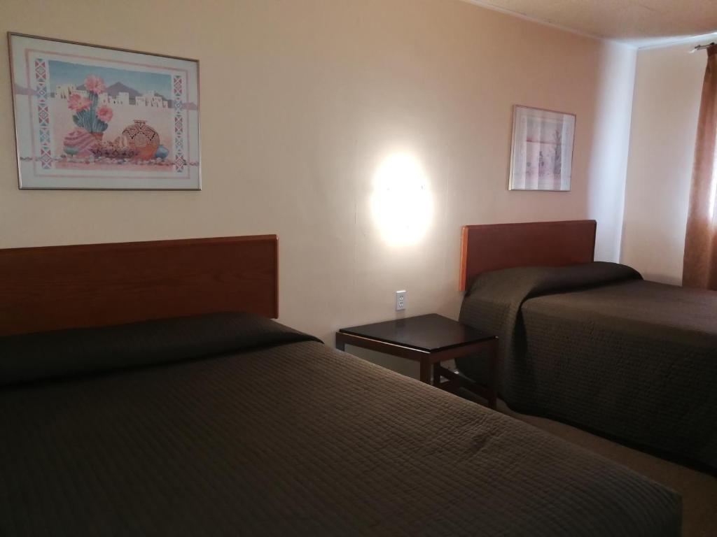 Postel nebo postele na pokoji v ubytování Star Motel