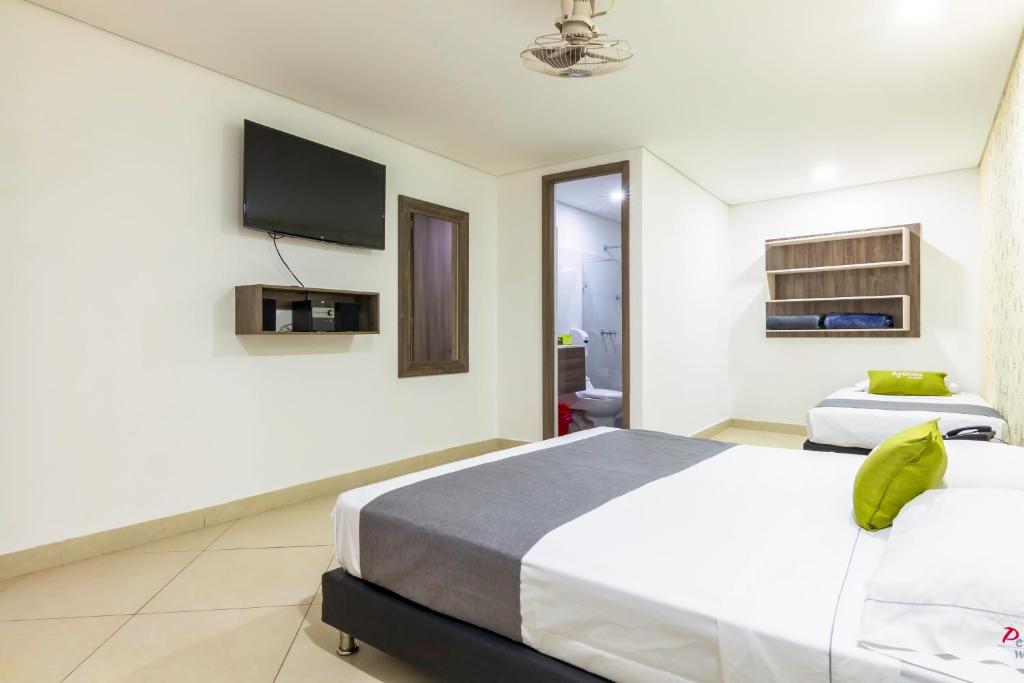 Postel nebo postele na pokoji v ubytování Hotel Perlatto