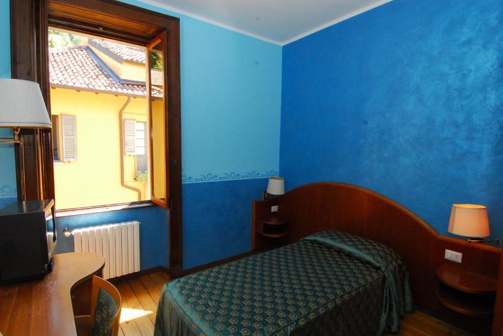 Postel nebo postele na pokoji v ubytování Fiò & Giò