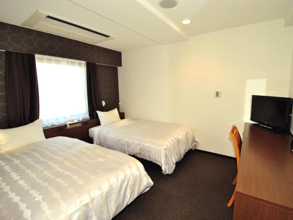 Postel nebo postele na pokoji v ubytování Hotel Mark-1 Abiko