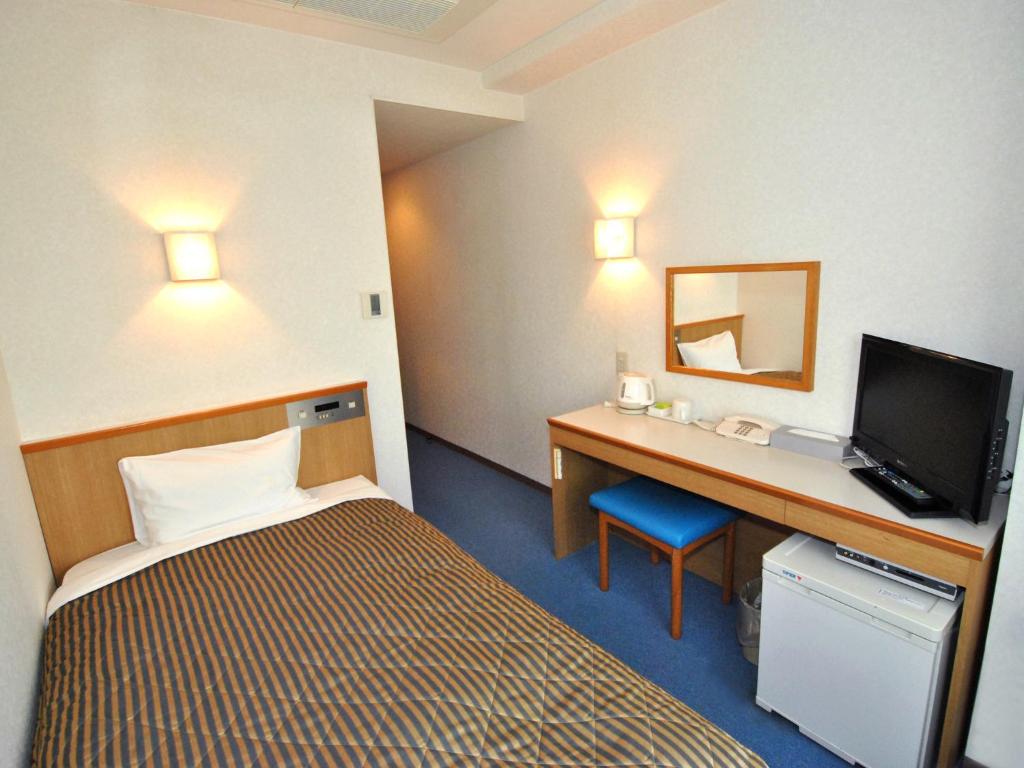 Postel nebo postele na pokoji v ubytování Hotel Mark-1 Abiko