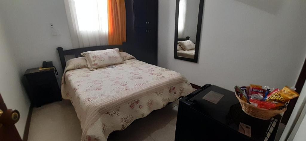 Postel nebo postele na pokoji v ubytování Hotel Colonial
