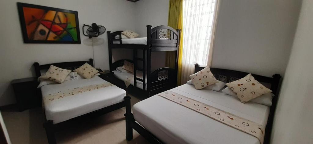 Postel nebo postele na pokoji v ubytování Hotel Colonial
