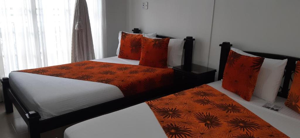 Postel nebo postele na pokoji v ubytování Hotel Colonial