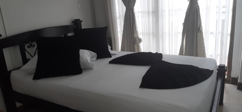Postel nebo postele na pokoji v ubytování Hotel Colonial