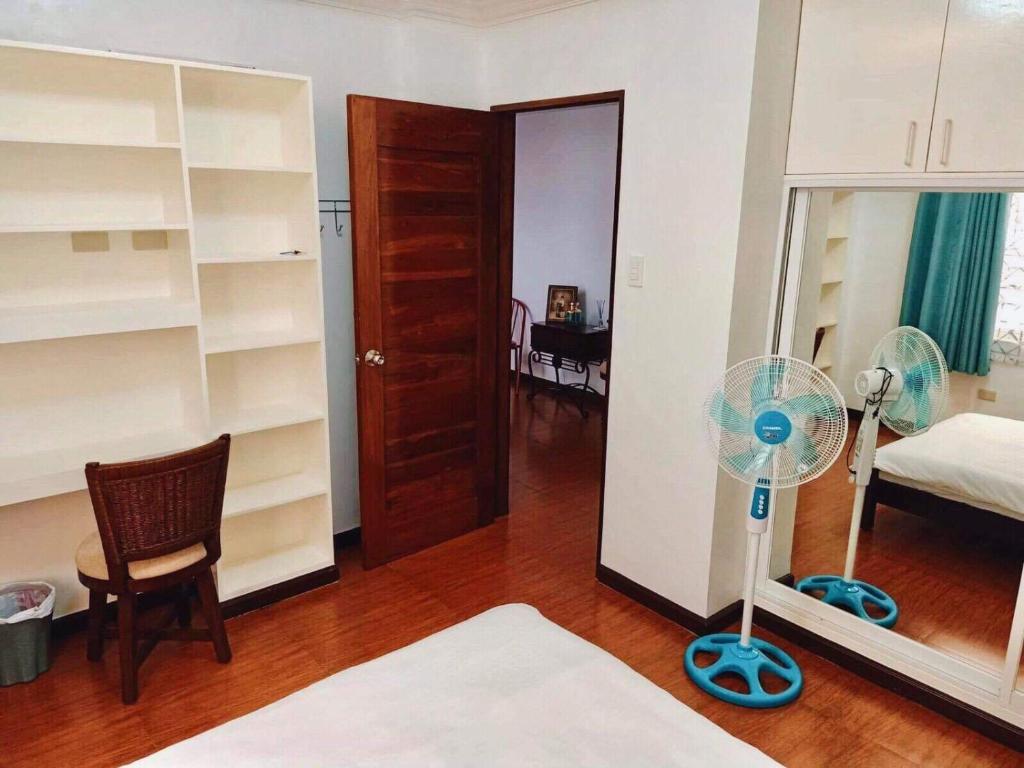 Postel nebo postele na pokoji v ubytování AJ's Haven Homestay