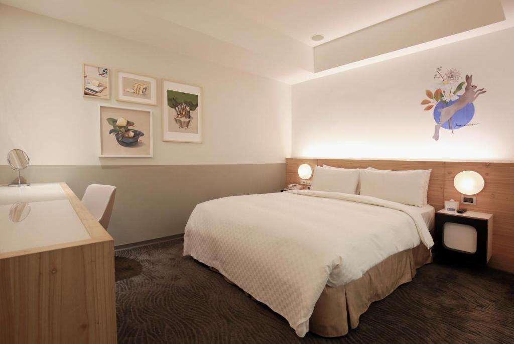 Postel nebo postele na pokoji v ubytování Dandy Hotel-Daan Park Branch